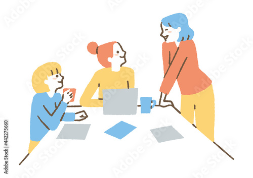 会社で談笑する女性たち