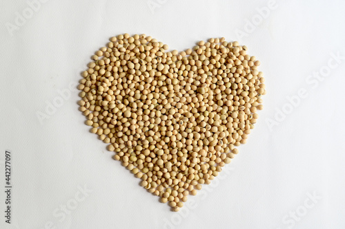 Top Views of Soybean in the shape of a heart isolated on the white background, Healthy Food Concept.