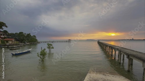 Wallpaper Mural Time lapse of unknown fishing boat on tropical beach with colorful sea background at beautiful sunset Torontodigital.ca