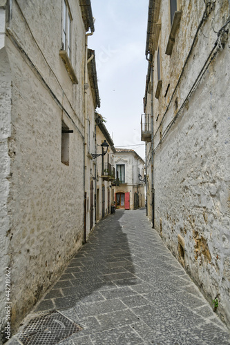 Bovino, Italy, 06/23/2021. A narrow street among the old houses of a medieval town with a Mediterranean style in the Puglia region. © Giambattista