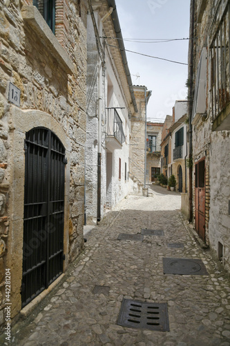 Fototapeta Naklejka Na Ścianę i Meble -  Bovino, Italy, June 23, 2021. A narrow street among the old houses of a medieval village in southern Italy.