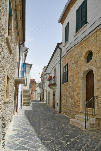 Bovino, Italy, 06/23/2021. A narrow street among the old houses of a medieval town with a Mediterranean style in the Puglia region.