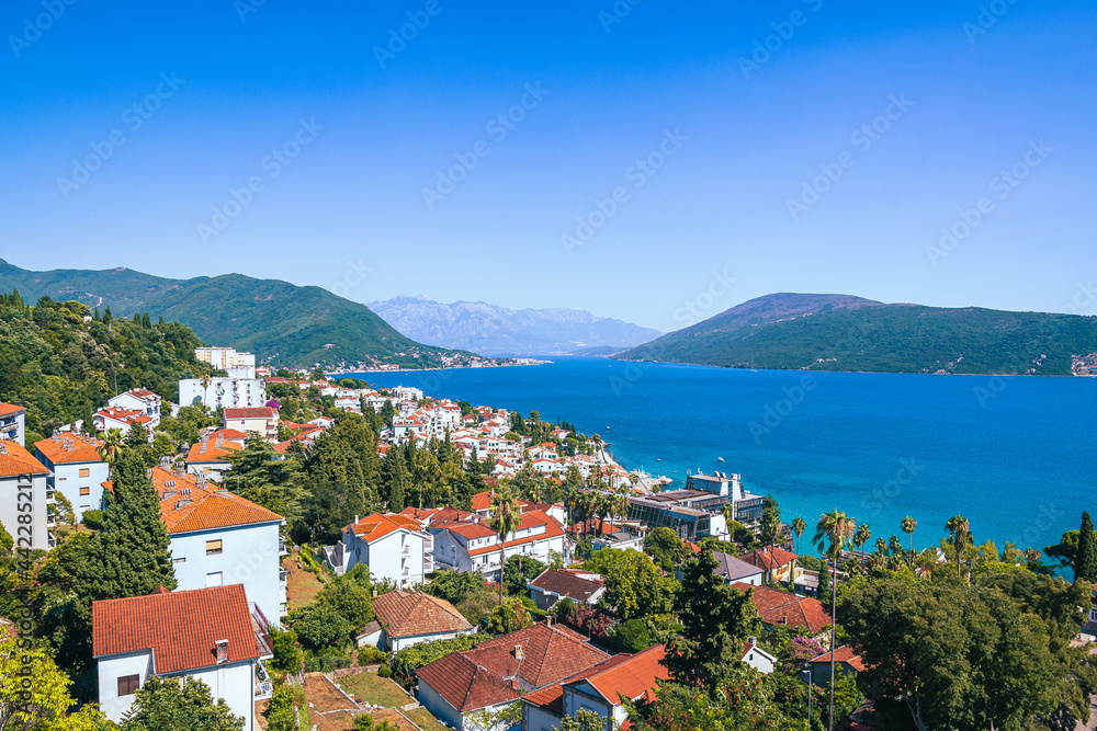 Summer view on houses with red roof and Bay of Kotor Summer view on houses with red roof and Bay of Kotor