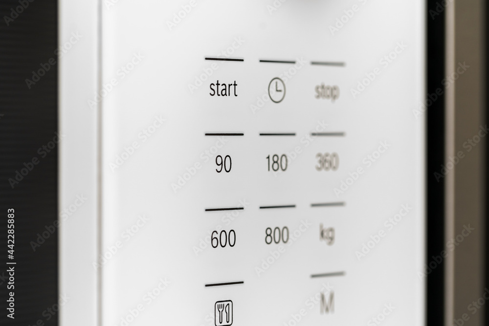 New modern microwave oven in a shop, close up New modern microwave oven in a shop, close up