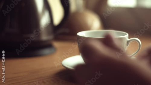 Close up. Put a tea bag into a cup. Pouring boiling water. Make tea.
