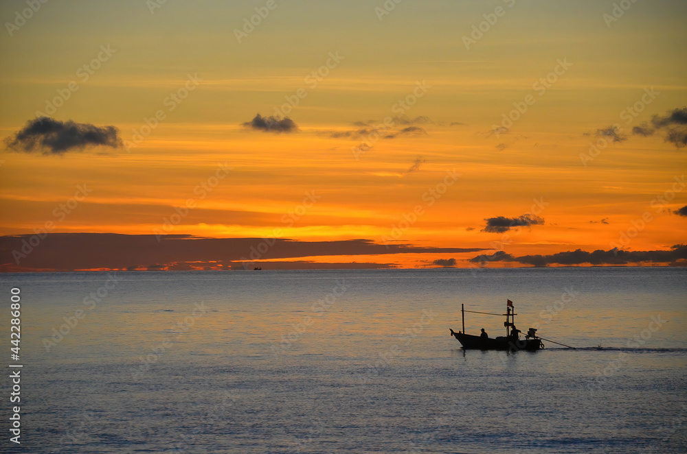 Colourful orange Cirrostratus cloudy tropical nautical sunrise seascape with fishing boat silhouette. Thailand. Colourful orange Cirrostratus cloudy tropical nautical sunrise seascape with fishing boat silhouette. Thailand.