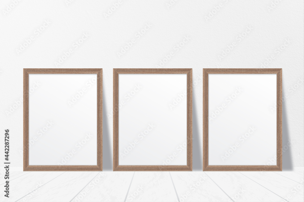 Mockup of three clean white minimalist blank wooden photo frames on the floor with shadow effect