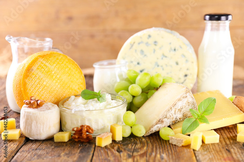 dairy products assortment on wood background