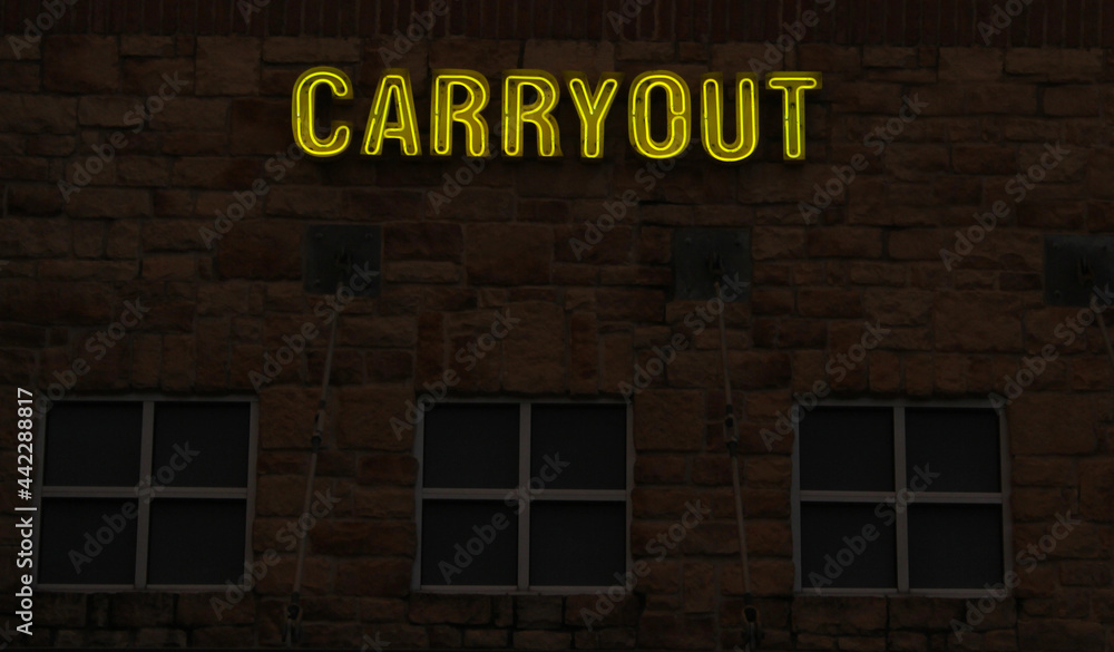 Obraz premium Vintage Neon Carryout Sign on Brick Building Wall