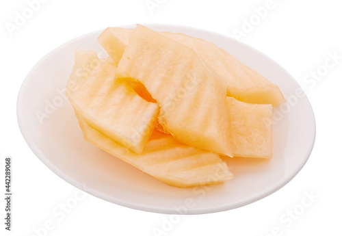 sliced piece cantaloupe melon on white plate