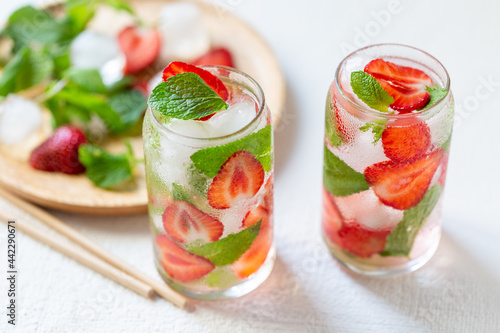 Refreshing water with strawberries and mint. Summer drink. Ingredients