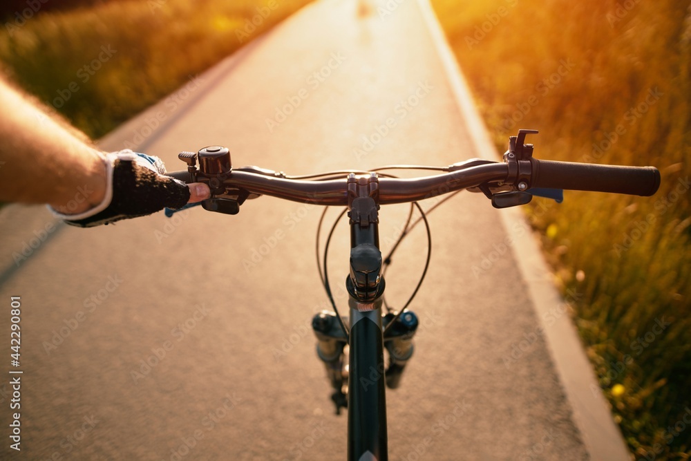 Riding on the handlebars of sales a bike