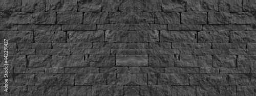 Black anthracite gray grey  natural  lava basalt stone wall texture, with wild bandage, privacy wall texture background banner panorama photo