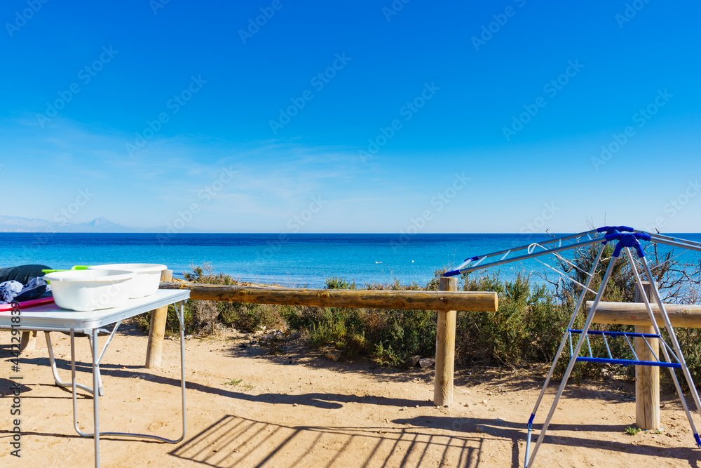 Camping on beach, empty clotheshorse Camping on beach, empty clotheshorse