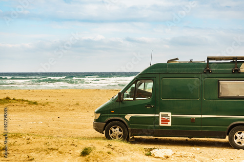 Camper van on beach in Spain.