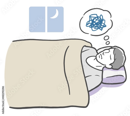 悩み事で眠れない若い男性