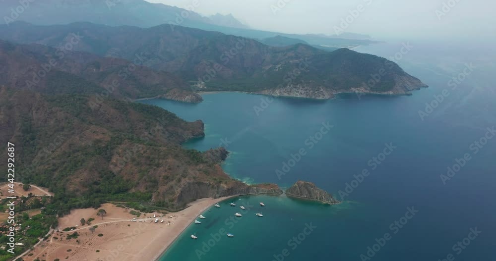 Aerial drone of Cirali beach and Olympos Olimpos mountain in a beautiful day light. Kemer, Antalya, Mediterranean region, Turkey, Lycia. Perfect sea view, nice for eyes of traveler. Aerial drone of Cirali beach and Olympos Olimpos mountain in a beautiful day light. Kemer, Antalya, Mediterranean region, Turkey, Lycia. Perfect sea view, nice for eyes of traveler.