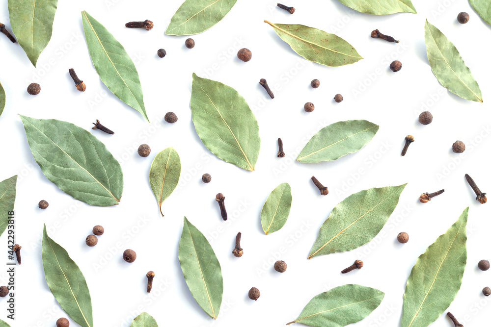 Dry bay leaves or laurel black pepper and cloves top view Dry bay leaves or laurel black pepper and cloves top view