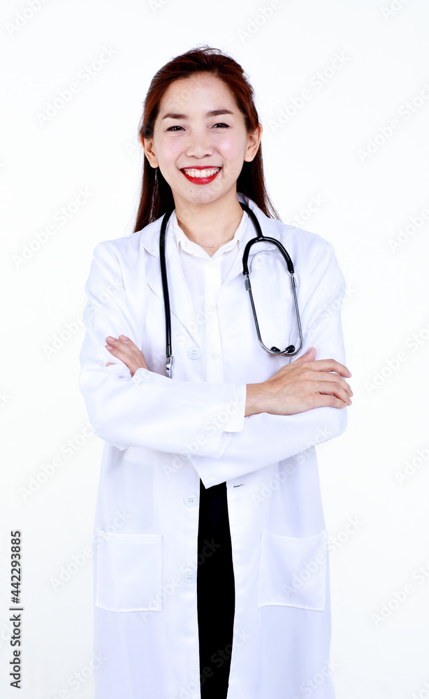 Smiling professional young Asian female physician in medical robe with stethoscope looking at camera while standing against white background. Smiling professional young Asian female physician in medical robe with stethoscope looking at camera while standing against white background.