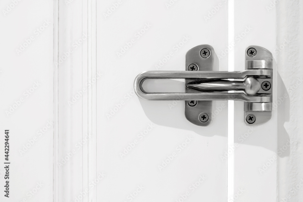 Close up of door security locked doors in hotel on wooden door-Security or safety concepts.