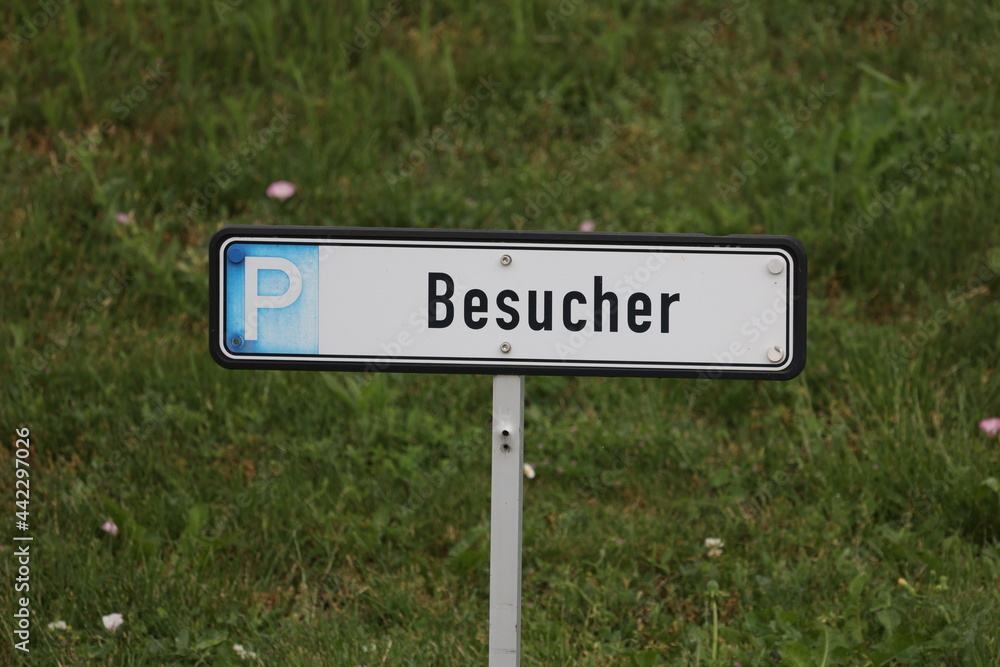 Parking place for visitors. Inscription in German - Visitors