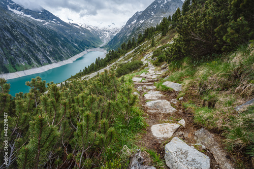 Fototapeta Naklejka Na Ścianę i Meble -  Beautiful view of Schlegeis Stausee on mountain hiking path trail. Zillertal, Austria, Europe
