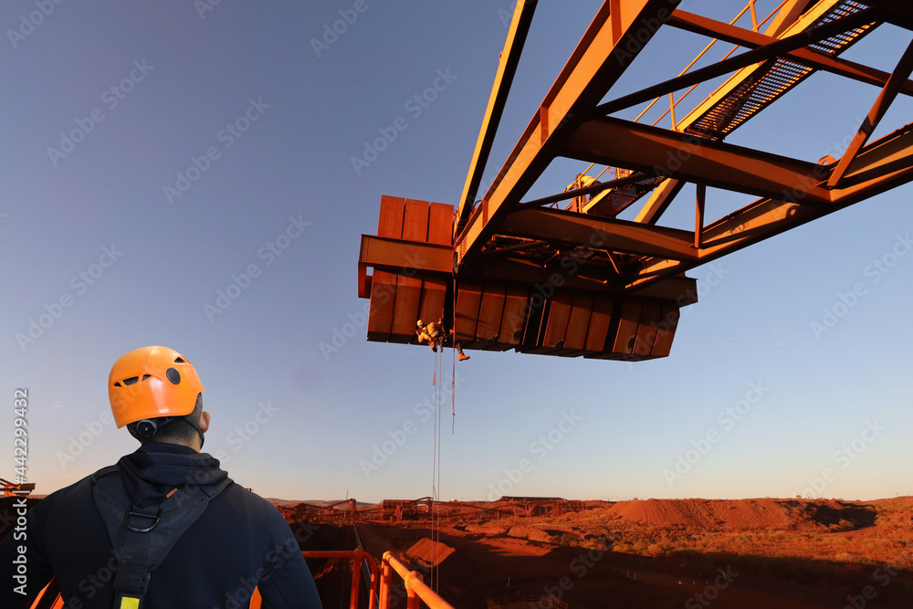 Certified site safety rope access supervisor wearing yellow safety fall
