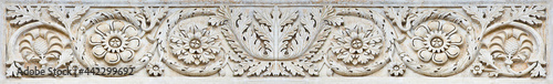 фотографія Aged roman frame of carved stone with geometric and foliage shape