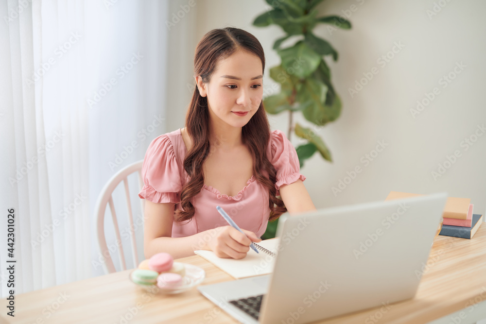 Happy casual entrepreneur working on line typing with a laptop at home Happy casual entrepreneur working on line typing with a laptop at home
