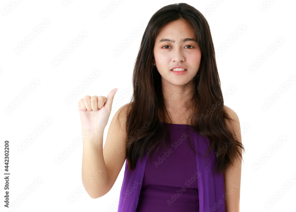 Serene ethnic female pointing up with index finger on white background in studio and looking at camera Serene ethnic female pointing up with index finger on white background in studio and looking at camera