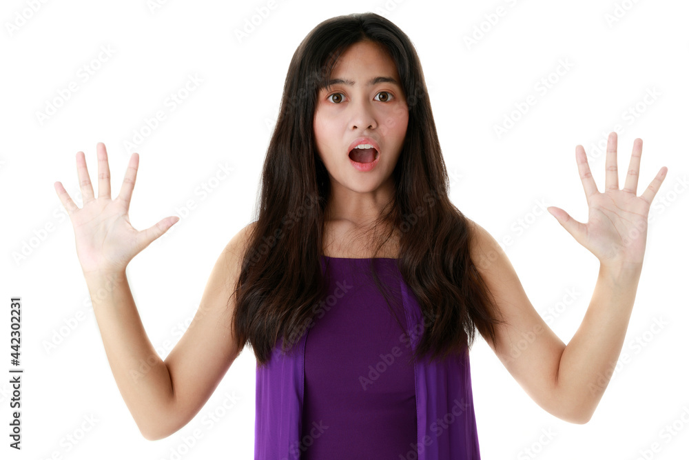 Frightened ethnic female with opened mouth looking at camera on white background in studio Frightened ethnic female with opened mouth looking at camera on white background in studio