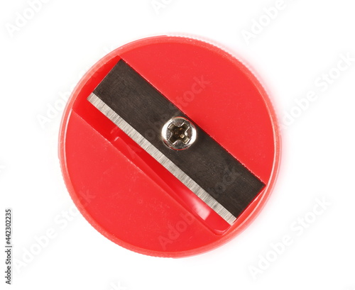 Obraz na płótnie Round red plastic pencil sharpener isolated on white background, top view