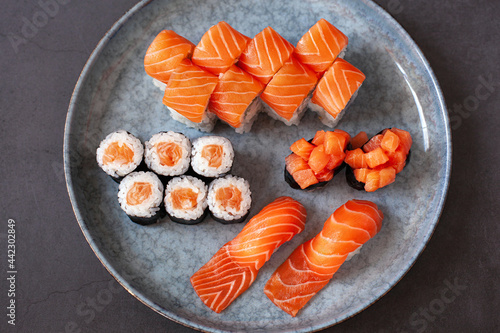 Assorted sushi nigiri and maki with salmon. Big set on plate
