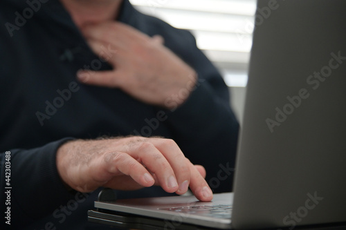 фотографія Man watching porn on laptop computer