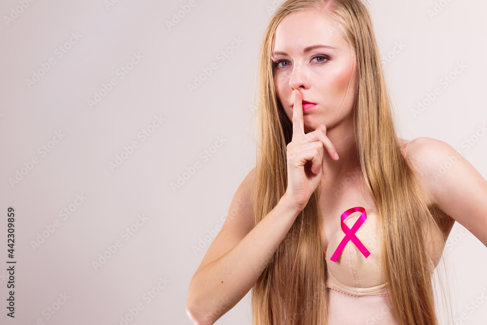 Woman pink cancer ribbon on breast Woman pink cancer ribbon on breast