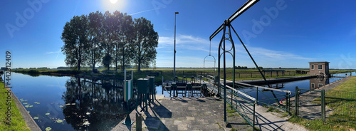 Panorama from a canal lock around Nieuwehorne photo