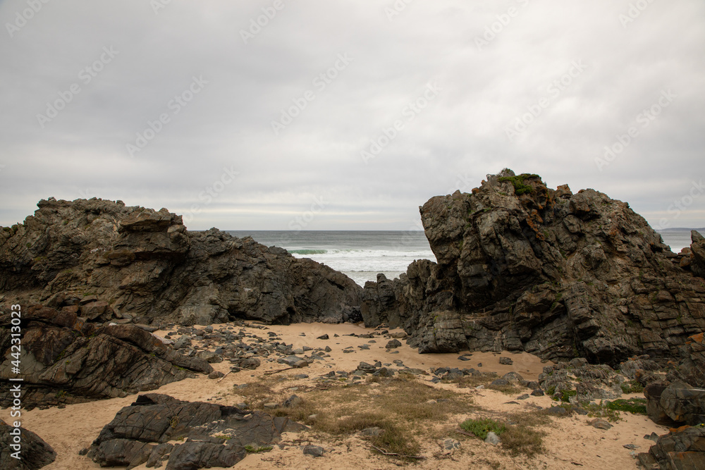 Huge rocks next to the ocean Huge rocks next to the ocean