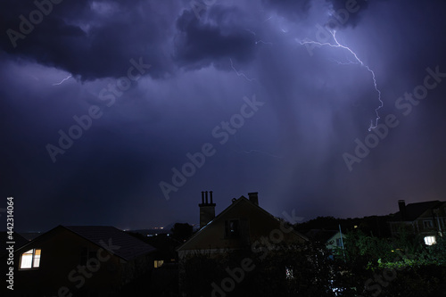 Beautiful lightning flashes in the evening sky during a thunderstorm