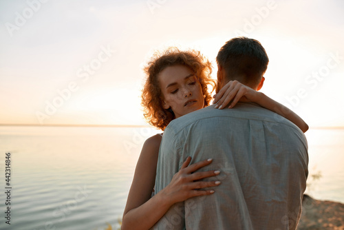 Portrait of sensual young man and woman hugging