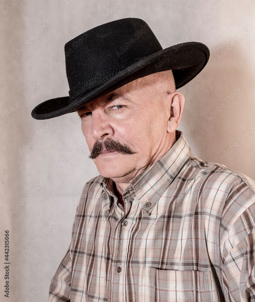 The cowboy with mustache, in a black hat The cowboy with mustache, in a black hat