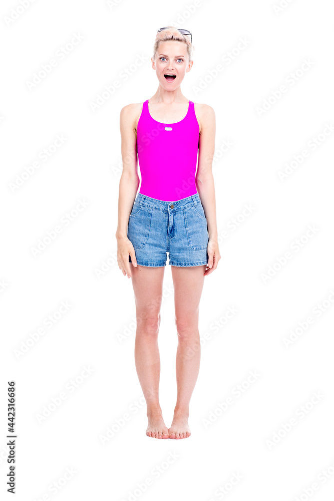 Vertical full length studio portrait of young Caucasian woman wearing summer outfit amused with something, white background Vertical full length studio portrait of young Caucasian woman wearing summer outfit amused with something, white background