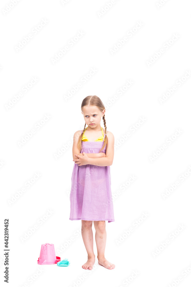 Vertical full length studio portrait of cute Caucasian girl wearing summer outfit standing with arms crossed angry with something, white background Vertical full length studio portrait of cute Caucasian girl wearing summer outfit standing with arms crossed angry with something, white background