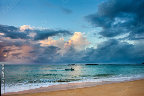 Beautiful colorful sunrise over the Indian ocean shore. Natural outdoors travel background.