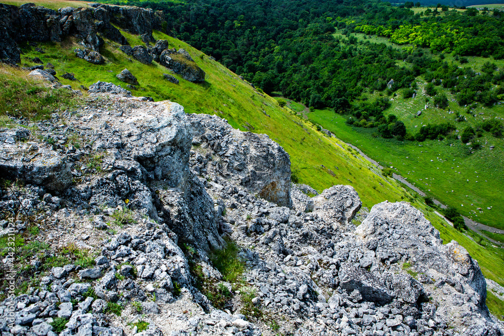 Beautiful green landscapes with hills, forest and rocks in Moldova. Eco tourism without people. Beautiful green landscapes with hills, forest and rocks in Moldova. Eco tourism without people.