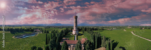 Aerial view of the Tower of San Martino della Battaglia at sunset. Italian tower on a background of pink clouds. The famous Tower of San Martino della Battaglia  Lake Garda Italy.