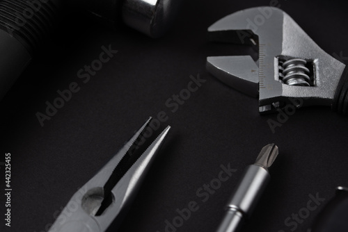 Black tools on black background