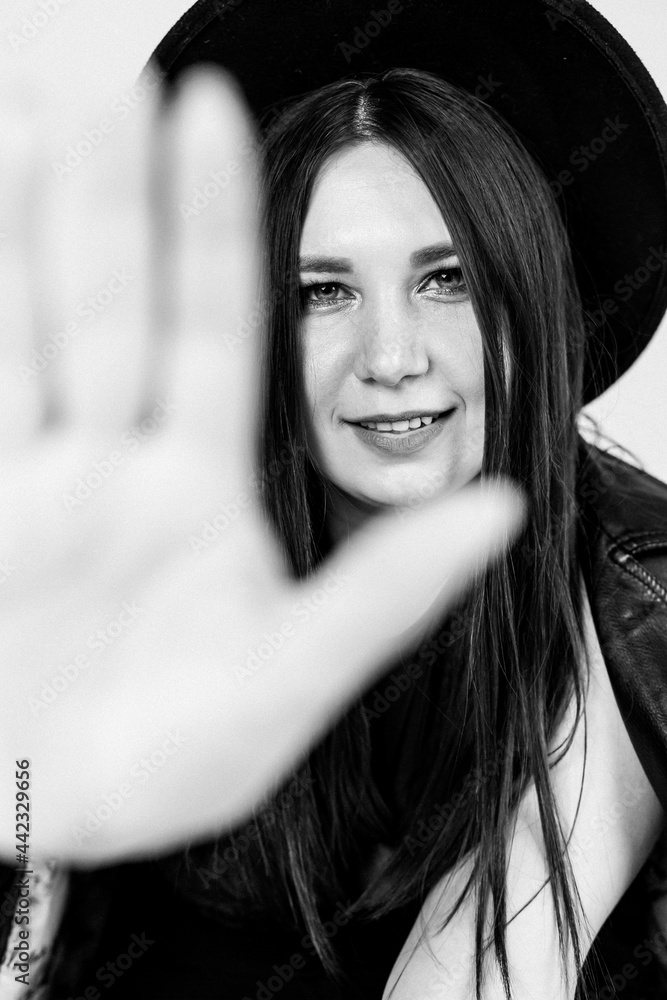 Girl in a sexy costume. Good model. Beautiful girl. White background. noise effect. black and white photography Girl in a sexy costume. Good model. Beautiful girl. White background. noise effect. black and white photography