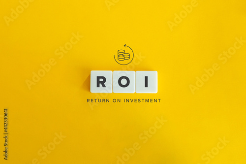 Return on Investment (ROI) banner and concept. Block letters on bright yellow background. Minimal aesthetics. photo