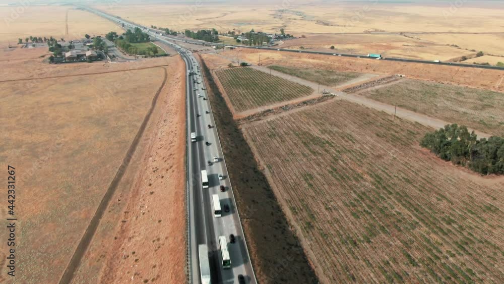 Aerial: Traffic on the Interstate 5 in Grapevine that flows into Los Angeles, California, USA, California, USA Aerial: Traffic on the Interstate 5 in Grapevine that flows into Los Angeles, California, USA, California, USA