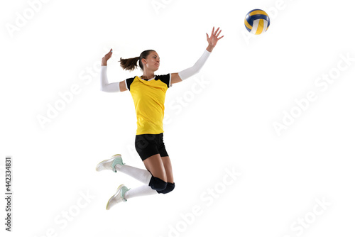 Female professional volleyball player with ball isolated on white studio background. The athlete, exercise, action, sport, healthy lifestyle, training, fitness concept.